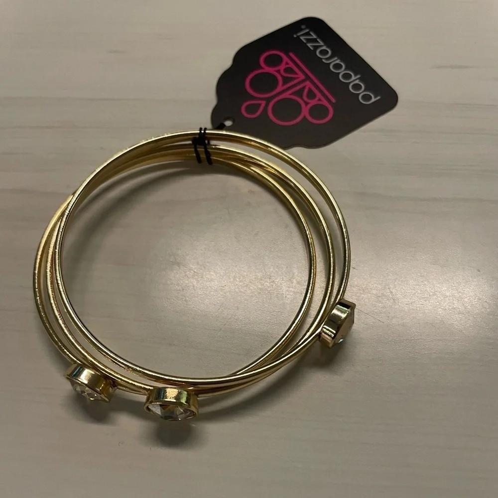 NWT paparazzi Gold Bangle Bracelet set of 3.